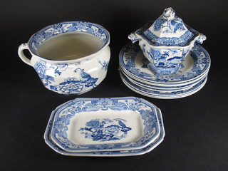 A Masons ironstone blue and white chamber pot the base with  blue Masons mark together with an 11 piece Masons blue and  white dinner service comprising twin handled soup tureen and  cover 8", 2 lozenge shaped dishes 10" and 9 1/2", 4 soup bowls  10" - 1 with slight firing imperfection to back, side plate 9 1/2"  and 3 dinner plates 10" - 1 cracked