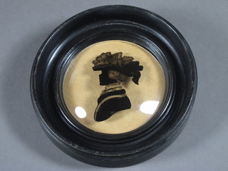A silhouette on convex glass "Victorian Bonnetted Lady" 2 1/2"