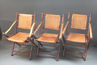 A set of 3 mahogany and brass framed folding campaign style  chairs