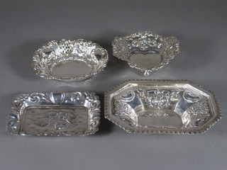 An embossed lozenge shaped silver dish - marks rubbed, a  modern silver pin tray decorated angels, a circular pierced silver  dish and a silver heart shaped dish 5 1/2 ozs