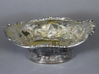 A Victorian embossed silver gilt fruit bowl decorated buildings, raised on a spreading foot, London 1842 19 ozs  10"   ILLUSTRATED