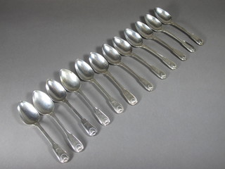 A set of 12 George III silver fiddle and thread pattern pudding  spoons with armorial decoration, London 1811, 24 ozs

3 SPOONS ARE DATED 1832