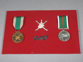 2 Oman medals