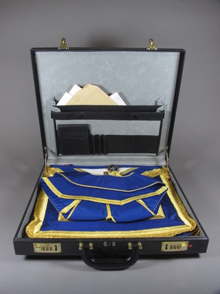 An attache case containing a collection of Masonic regalia comprising London Grand Rank officer's full dress and undress  regalia and collar complete with collar jewel and a Royal Arch  Principals apron and sash