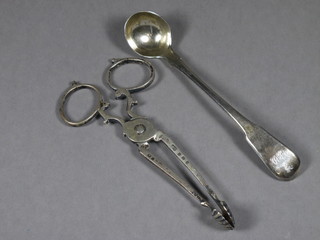 A pair of Edwardian silver sugar nips Birmingham 1904 and a Georgian fiddle pattern mustard spoon
