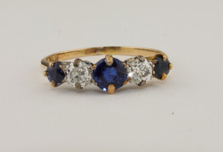 A lady's yellow gold dress ring set sapphires and diamonds