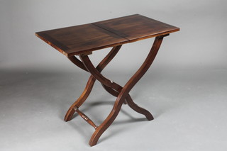A mahogany folding campaign style table 32"w x 18"h