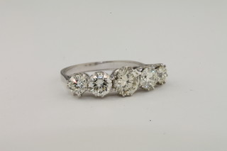 A lady's 18ct white gold dress/engagement ring set 5 diamonds,  approx 1.87ct