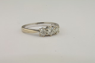 A lady's 18ct white gold dress ring set 3 diamonds, approx  0.50ct