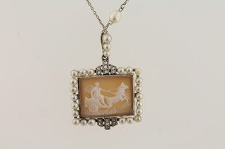 A rectangular cameo pendant contained in a diamond and pearl mounted frame hung on a pearl and white metal necklet