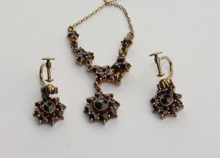 A lady's 14ct gold necklace and earrings set garnets