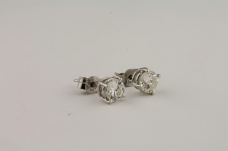 A pair of 14ct white gold diamond stud earrings approx 1ct