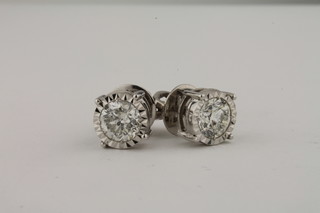 A pair of 18ct white gold circular cut diamond set ear studs, approx 1.97