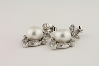 A pair of Victorian style drop earrings set diamonds and pearls approx 1ct