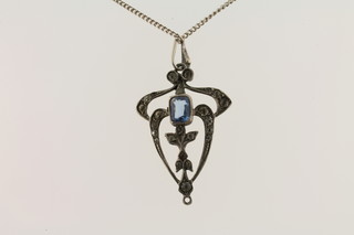 A marcasite pendant hung on a fine silver chain
