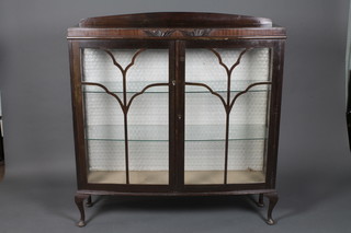 A 1930's Georgian style mahogany bow front display cabinet  with raised back, fitted shelves enclosed by astragal glazed  panelled doors, on cabriole supports 46"w x 11"d x 50"h