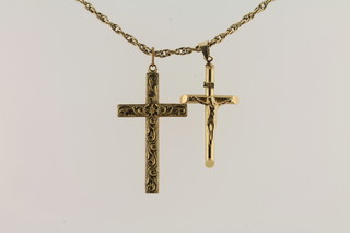 A gilt metal chain hung a crucifix and a cross