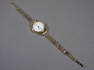 A lady's Tissot wristwatch contained in a gilt metal case with a 9ct gold integral bracelet