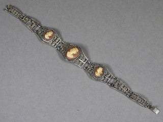 A marcasite bracelet with shell carved cameo portraits