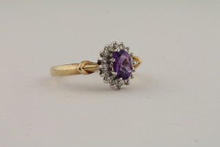 A 9ct yellow gold cluster dress ring set amethysts and diamond