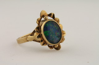 A 9ct gold dress ring set an opal triplet single stone
