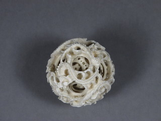 A carved ivory puzzle ball 1 1/2"