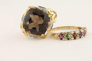 A 9ct gold dress ring together with a 9ct gold dress ring set a citrene
