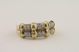 A 9ct gold dress ring set 2 rows of small diamonds