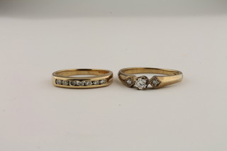 A lady's 9ct gold dress ring set 3 diamonds and a 9ct gold half eternity ring