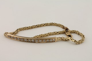 A 9ct gold bracelet set diamonds