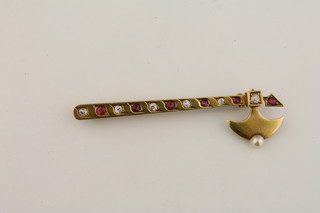 An 18ct bar brooch in the form of axe, set rubies, diamonds and pearl