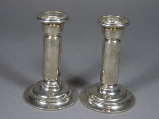 A pair of Edwardian silver candlesticks, Birmingham 1909 5"