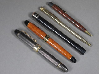 A Marksman fountain pen - f, a West German fountain pen, a  gilt cased ballpoint pen, a propelling pencil and 1 other
