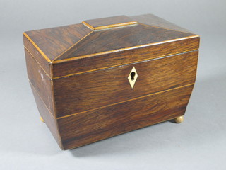 A Victorian inlaid rosewood twin section sarcophagus shaped tea caddy with ivory escutcheon raised on bun feet 8"w x 4"d x 5  1/2"h, 1 foot missing,