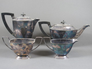 An Art Deco 4 piece silver plated tea service comprising teapot,  hotwater jug, twin handled sugar bowl and milk jug
