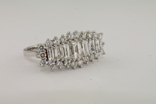 A lady's 18ct white gold dress ring set baguette cut diamonds  supported by diamonds, approx 2.42ct