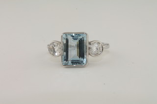 A lady's 18ct white gold dress ring set a rectangular cut aquamarine approx 2.42ct and with diamonds to the shoulders  approx 0.54ct