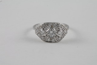 A lady's 18ct white gold dress ring set diamonds supported by  diamonds