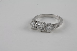 A lady's 18ct white gold dress ring set 3 large diamonds approx  1.70ct