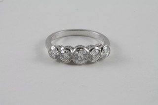 A lady's 18ct white gold dress ring set 5 circular cut diamonds approx 1.60ct