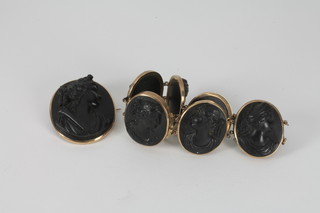 A Victorian black carved lava cameo brooch in a gilt metal  mount together with matching bracelet