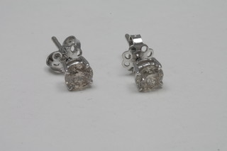 A pair of 14ct gold ear studs set diamonds, approx 1.50ct