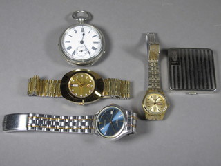 An open faced pocket watch contained in a plated mount, a lady's Seiko wristwatch in a gilt metal case and a gentleman's Rado  DiaStar wristwatch contained in a gilt metal case, a Pulsar  wristwatch and a chrome compact