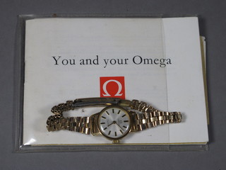 A lady's Omega wristwatch contained in a gilt case