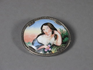 A brooch with porcelain panel decorated a lady