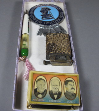 An enamelled radiator badge for the Royal National Mission for Deep Sea Fishermen, an enamelled match slip decorated The  Allies, a cigarette lighter and a propelling pencil