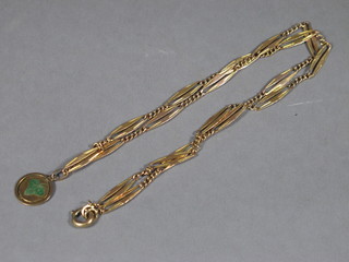 A gilt metal chain hung a gilt metal and enamel pendant