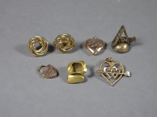 A 9ct gold padlock clasp, a gilt metal seal in the form of a ladder, axe and heart and a small collection of gold