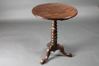 A Victorian circular mahogany wine table raised on a spiral turned column and tripod base 23"w x 38"h
