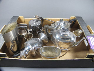 A silver plated teapot with demi-reeded decoration by Mappin & Webb, a 3 piece Britannia metal tea service with demi-reeded  decoration, do. hotwater jug, silver plated serving spoon etc